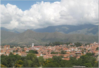 Photo of a city with mountains in the background