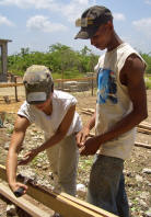 Vivien working with a hammer