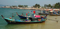 Long-tail boats along beach