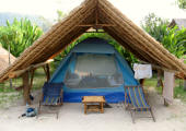 Tent under thatch roof